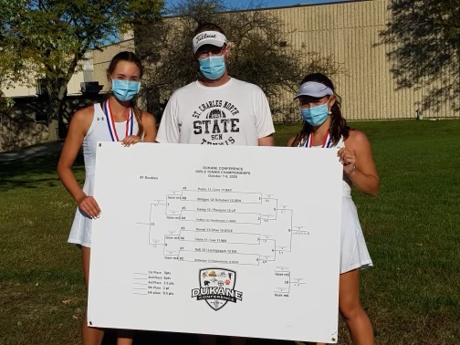 Leia Papanicholas and Tatum Settelmyer with their coah, Sean Masoncup, after winning the Dukane Conference as a doubles team.