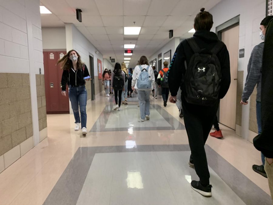 Students walk through the hallway on their way to their next class.