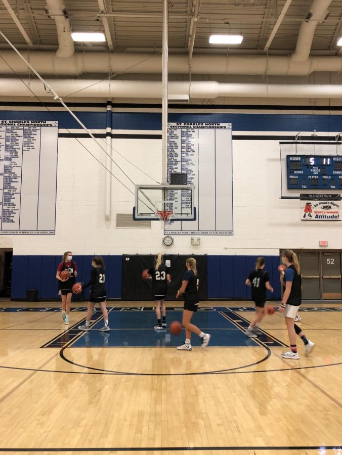 Basketball players do some drills during practice.