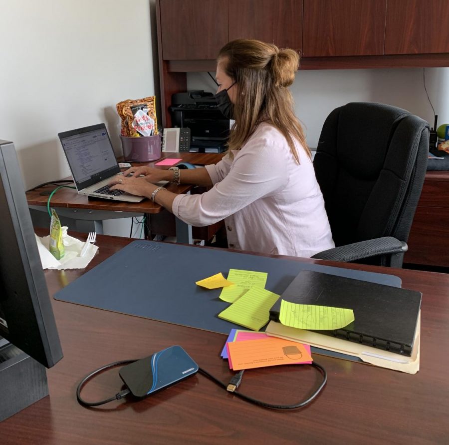 Lewis working at her desk