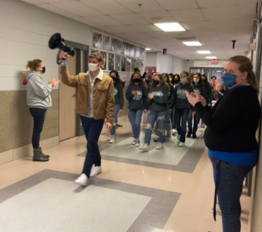 Girls cross country at their drum line send off to state