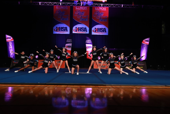 The cheer team performing at the state competition