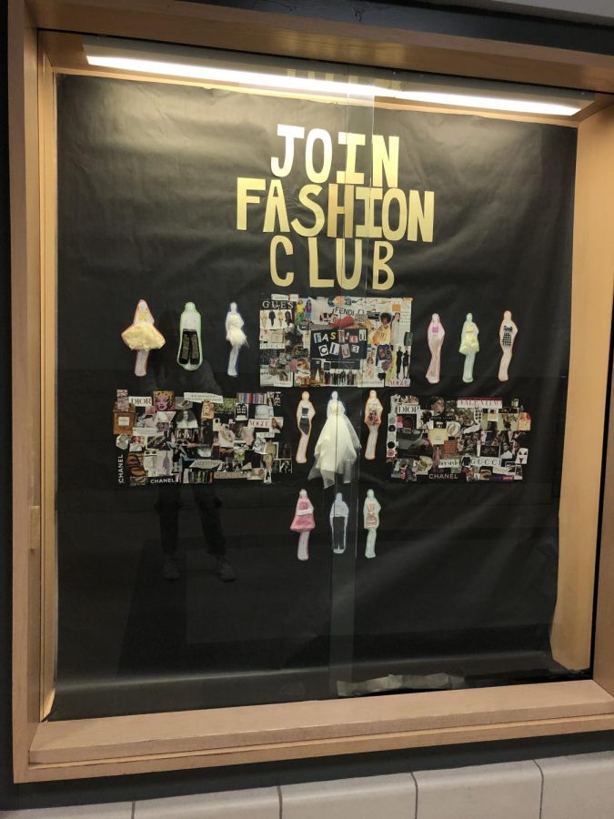 Fashion Club has a display case set up to promote their club to students