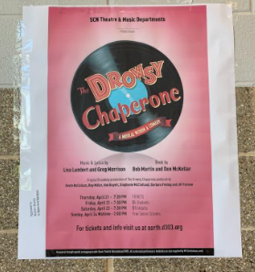 A poster advertising The Drowsy Chaperone hangs at North