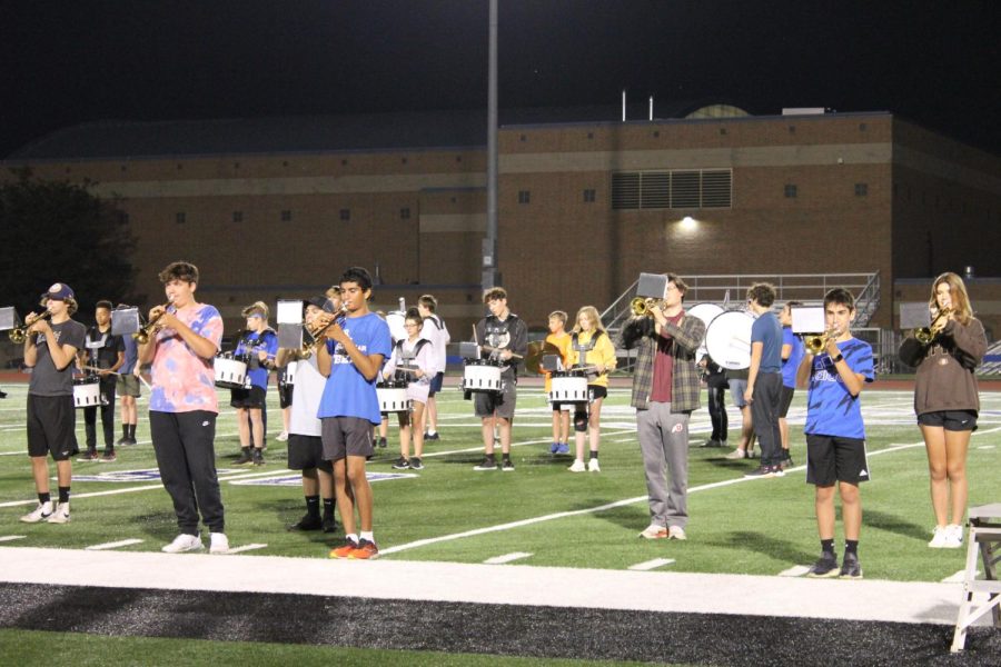 Marching Band rehearses their halftime show at a practice. 