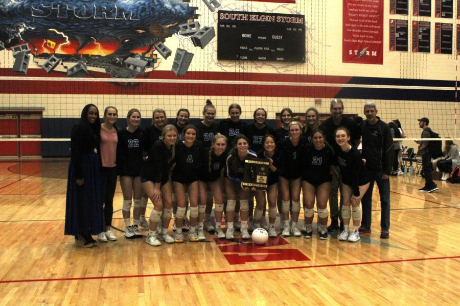 The+volleyball+team+receives+their+regional+champions+plaque.