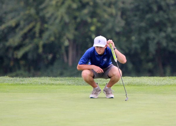 Clay Heilman lines up a putt. He placed first in both Norths conference and regional tournaments.
