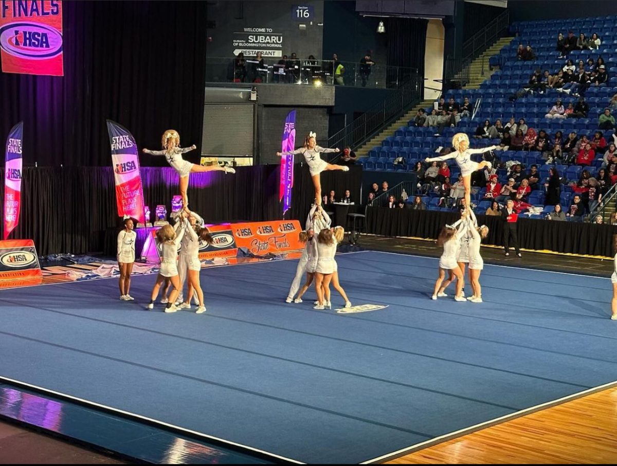 North varsity cheer in action at state competition.
