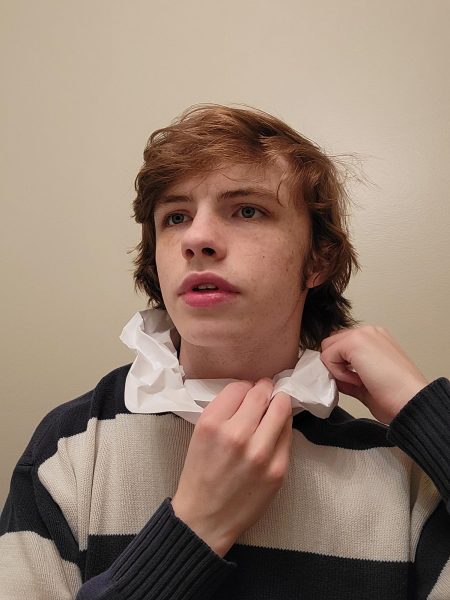 Peasant, senior and renowned author Tyler Moore wearing a homemade paper ruff.
