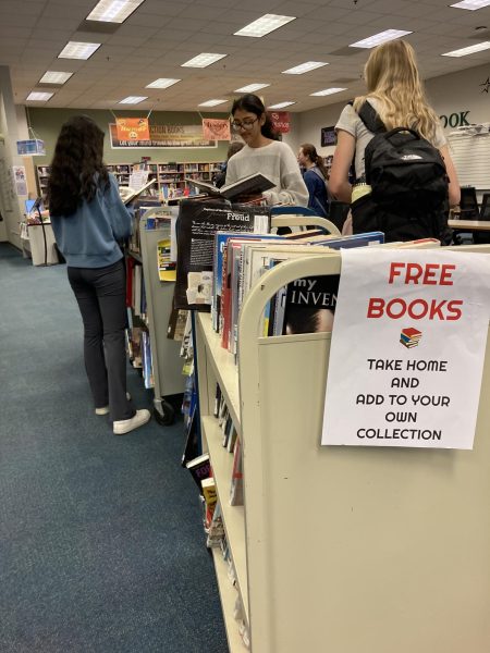Sophomores Javeria Hasan, Vidhi Patel and Emmy Skidmore browse the free books available in the LRC