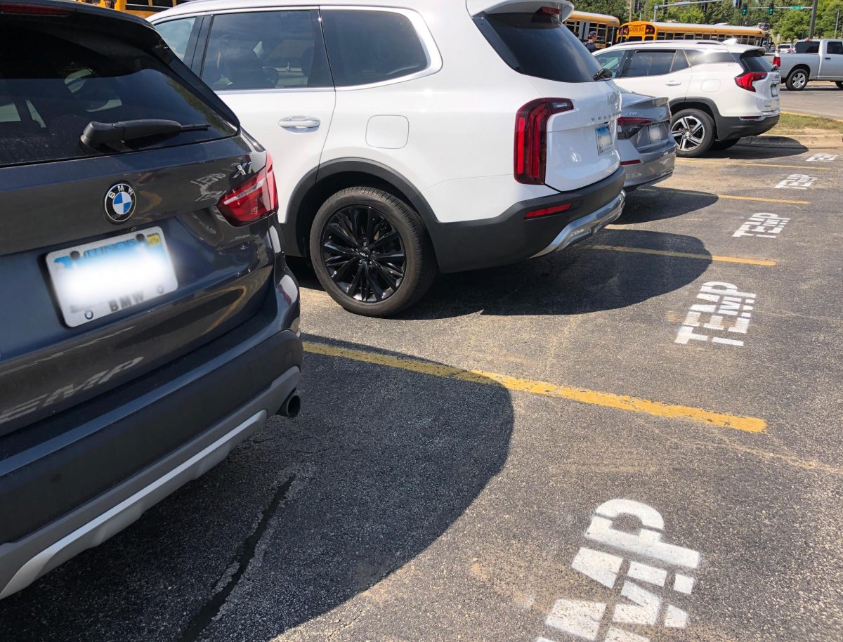 Cars parked outside North in temporary parking spaces.