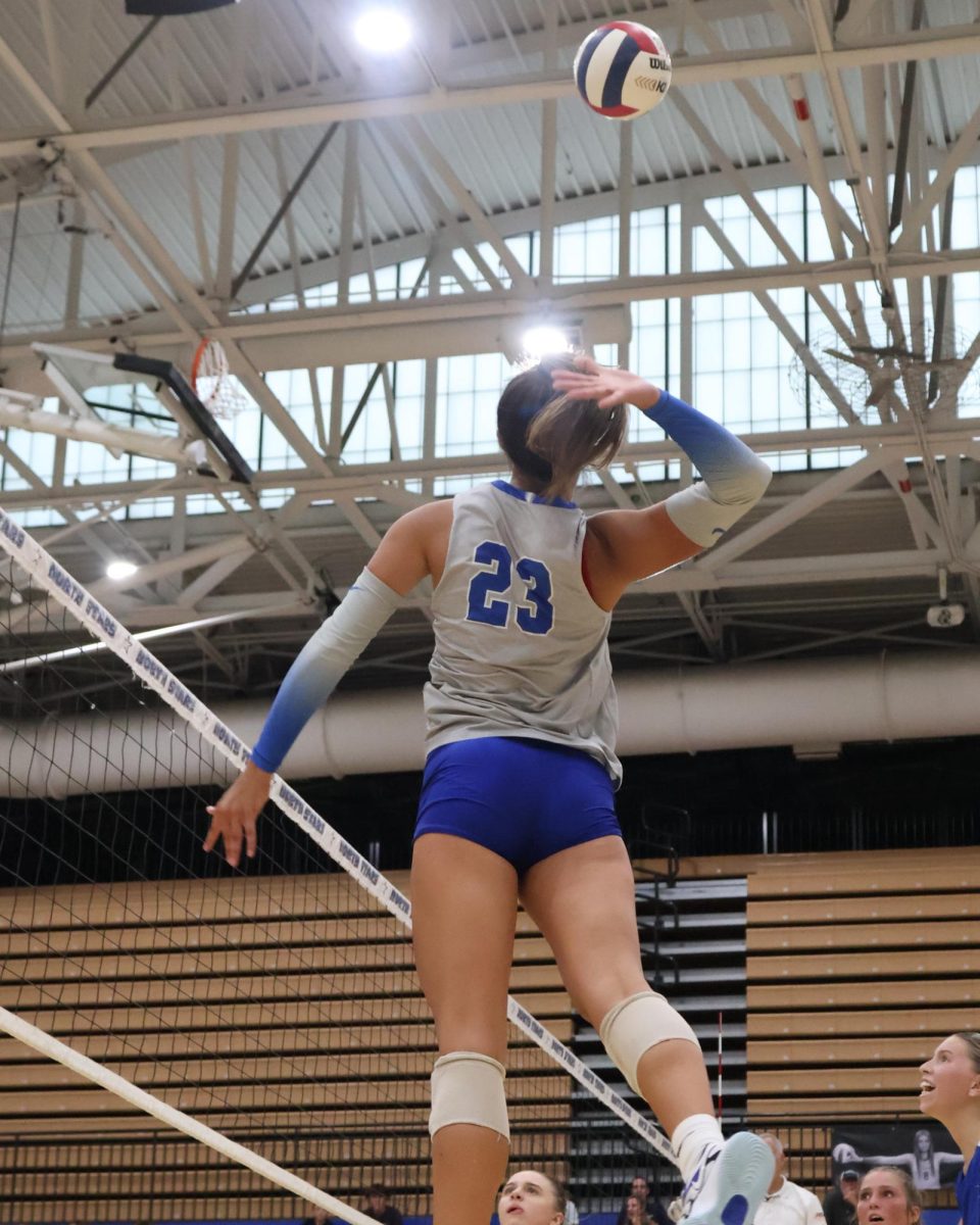 Haley Burgdorf going up to take a swing.