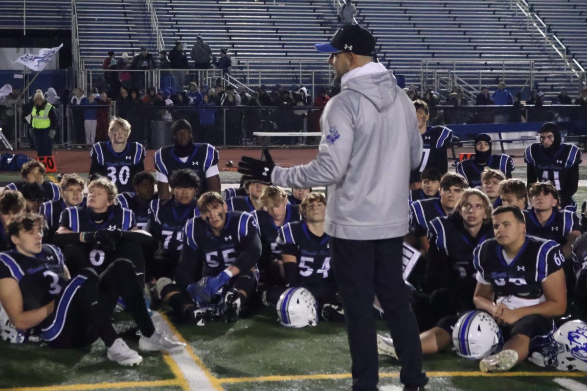 Football head coach Rob Pomazak addressing the team.