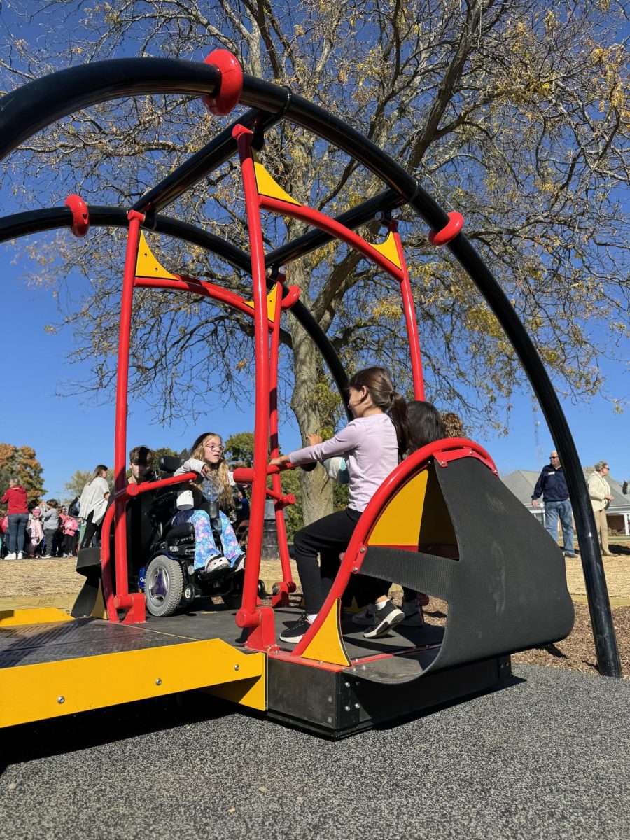 Students use the newly installed accessible swing at Wasco Elementary.