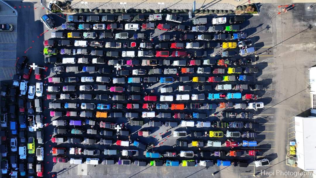 The convoy of over 400 Jeeps staged at the dealership.