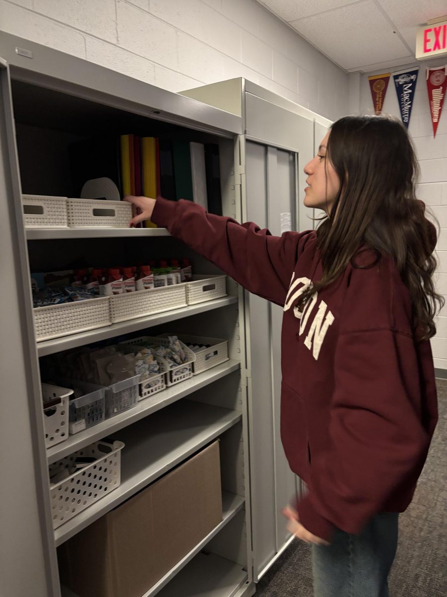 Gagne reaching into the community pantry.