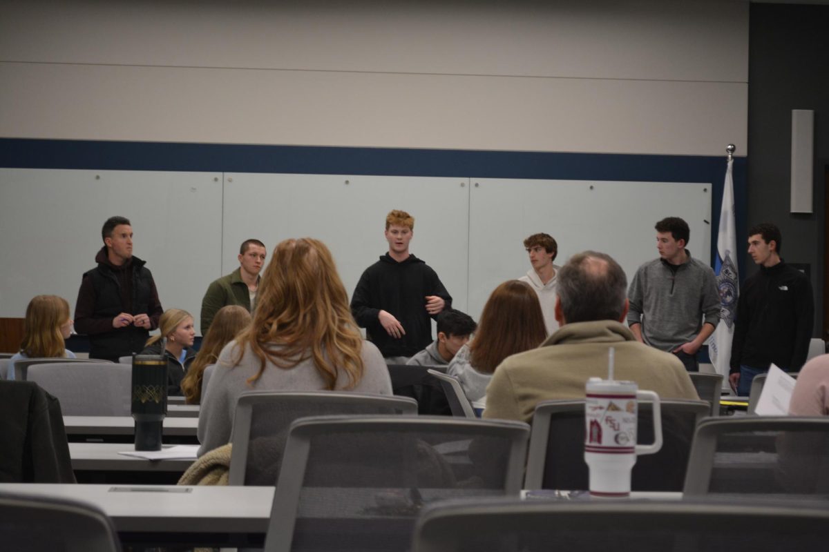 Youth Commission members listening to East senior Brad Monkmeyer's service learning project. Monkmeyer requested funding for a staff vs. student fundraiser at East where proceeds will go to local organization HardyStrong.