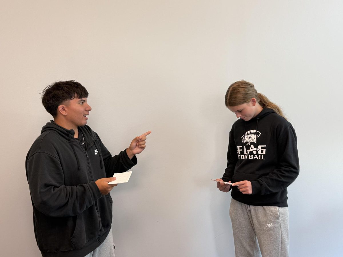 Freshman Steven Singh and sophomore Ellie Hegadorn participate in a debate.