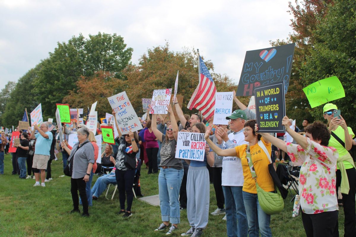 Protesters line Randall road in support of the No Kings protest, organized by many local groups, including Fox Valley's We Can Lead Change.