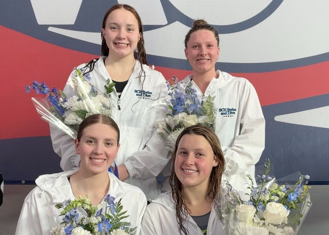 Senior Kate Farrell, junior Lulu Negro, sophomore Hannah Maksimuk, and senior Tess Stavropoulos after becoming the IHSA state champions in the 400 free relay