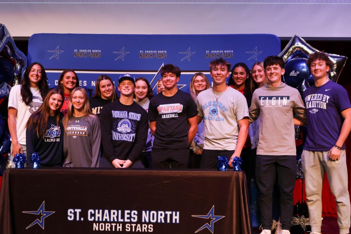 North students from Baseball, Lacrosse, Softball, Swim and Volleyball met in the auditorium for fall signing night.