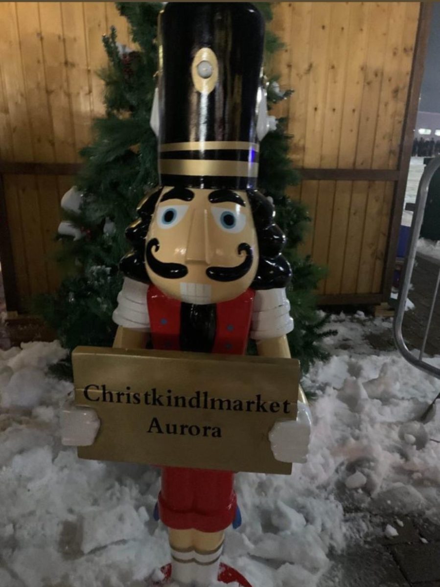 A sign outside of the Aurora Christkindlmarket welcomes visitors
