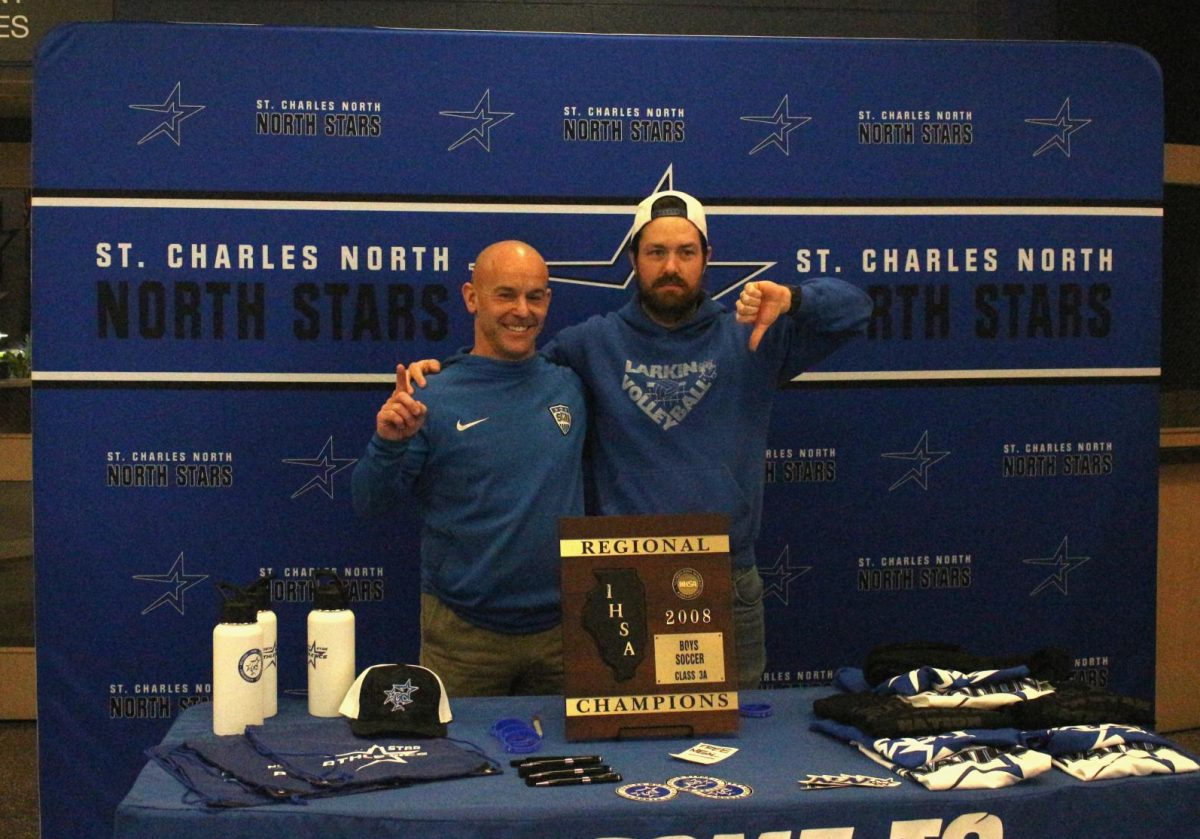 Kyle Milnamow poses with soccer coach Eric Willson, who coached the team that inevitably beat Larkin in 2008.