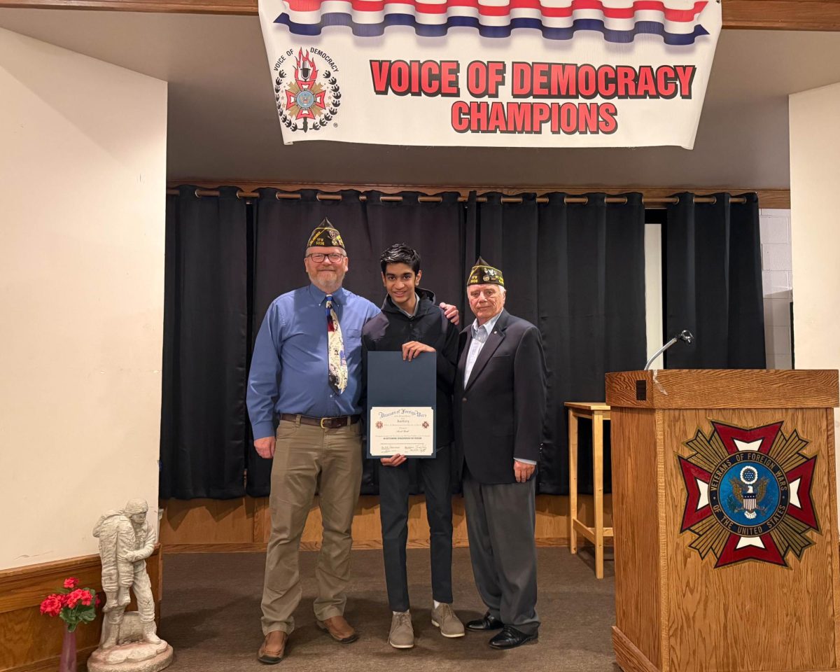Sophomore Aarush Parikh after receiving a certificate for his fifth place win at district banquet.