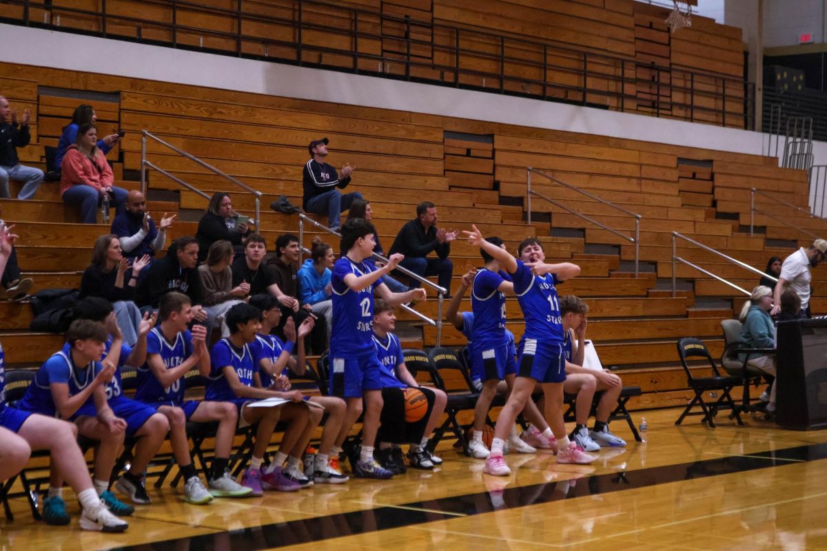 Freshman A team celebrates over game winning turnover in overtime at Glenbard North