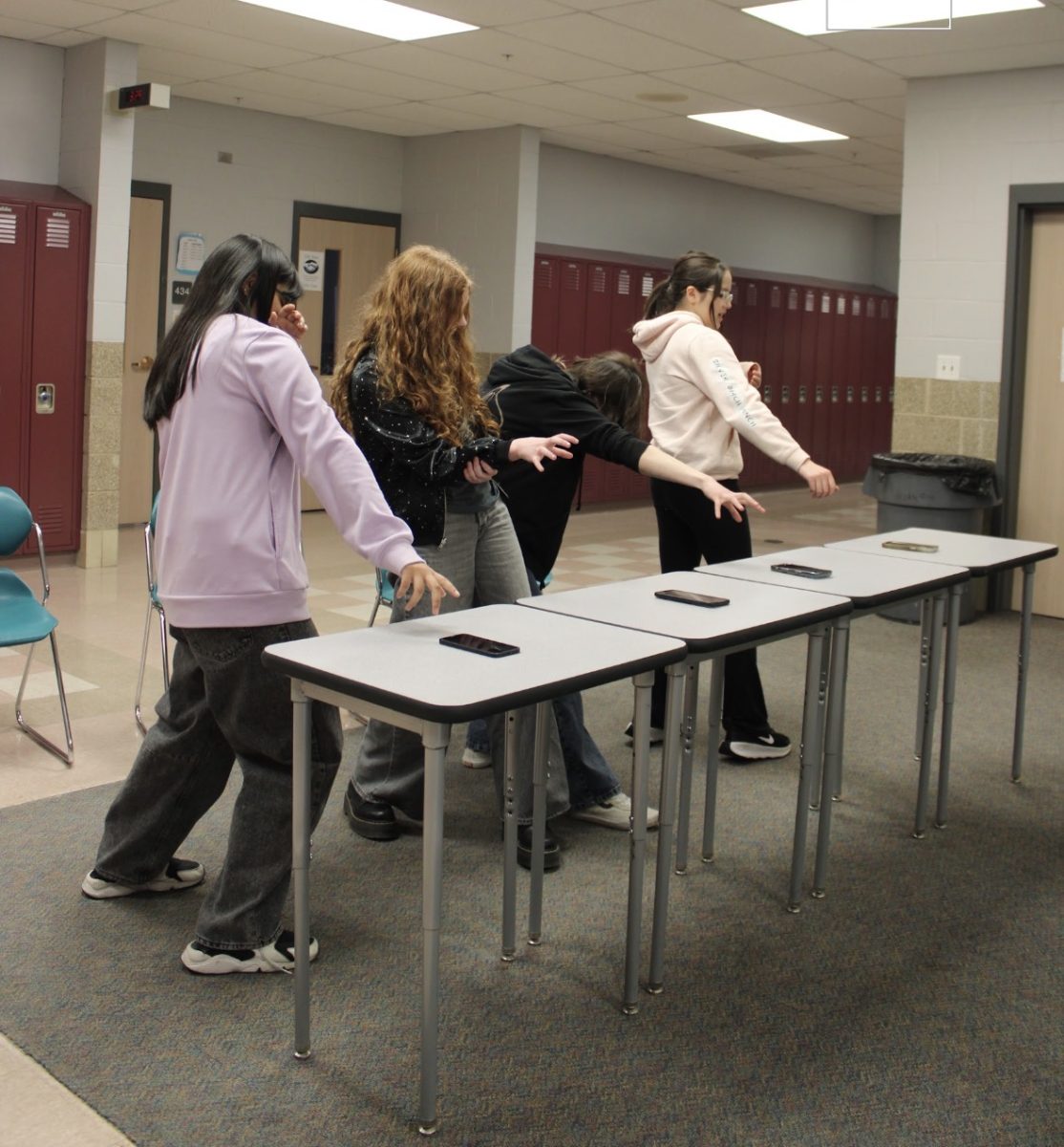 Freshmen Hannah Sit and Clara Anderson, junior Evie Wada, and senior Hannah Rodriguez train extensively for the next Olympic phoning challenge.
