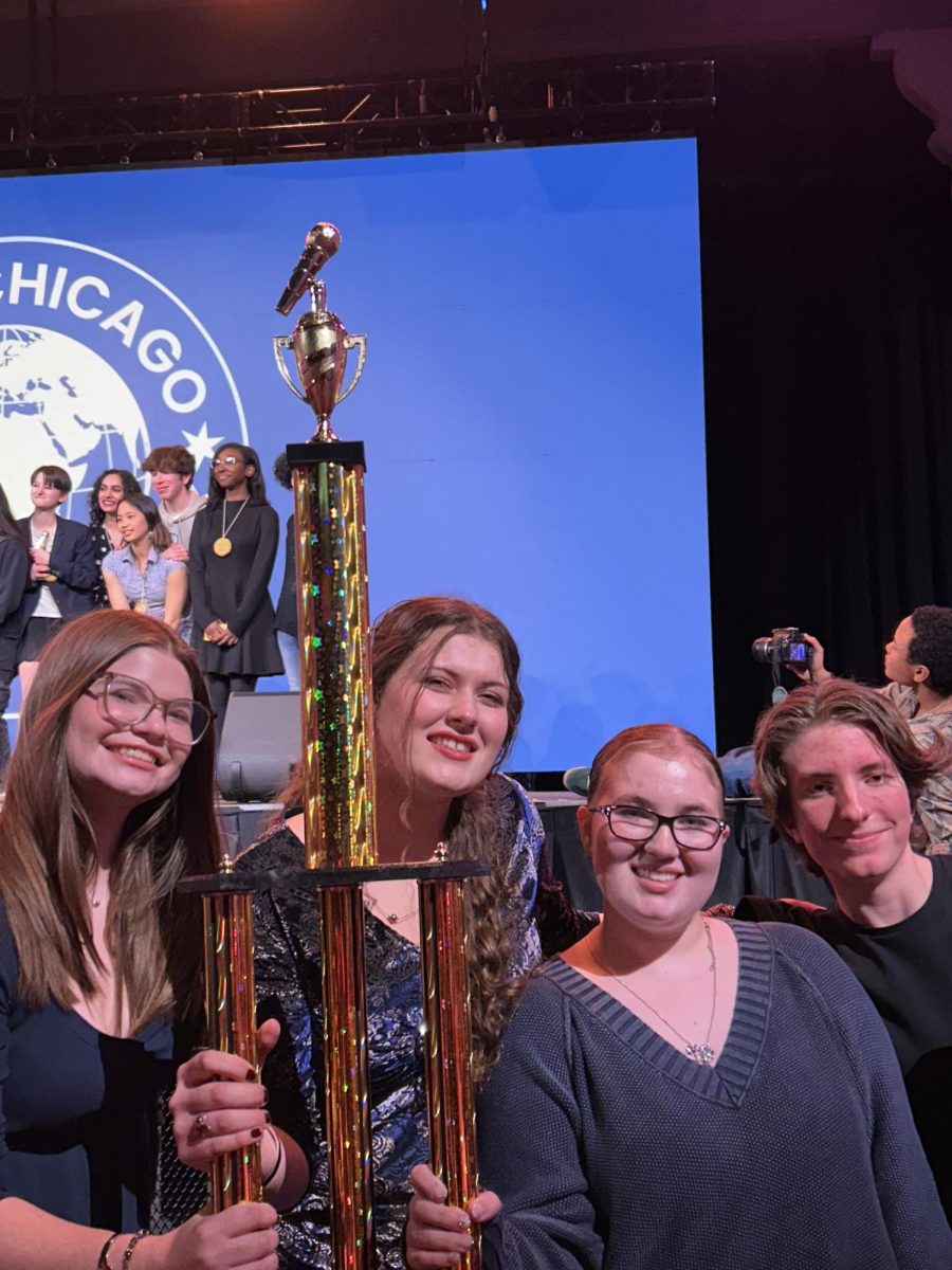 Seniors Tess Arendt, Lillianna Rederer, Alex Czerwinski, and Junior Leah Brett with their second place trophy at the slam poetry finals.