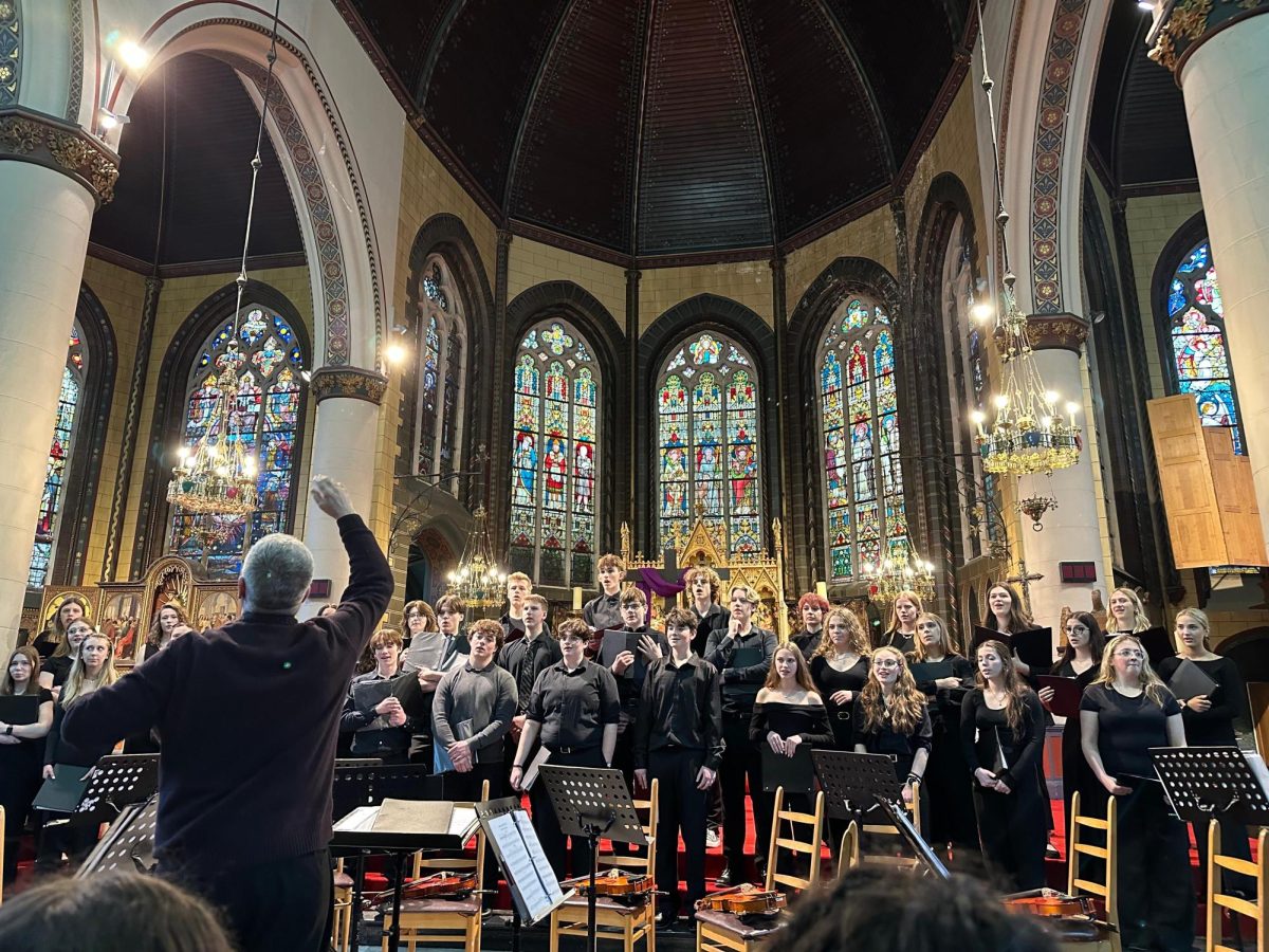 North and East Choirs perform at St. Giles Catholic Church in Belgium.
