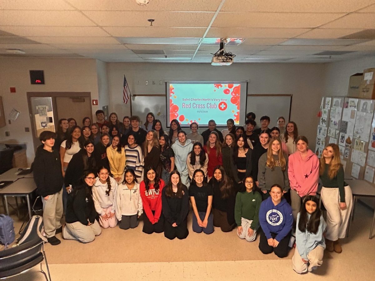 Students attend a meeting for the new Red Cross Club.