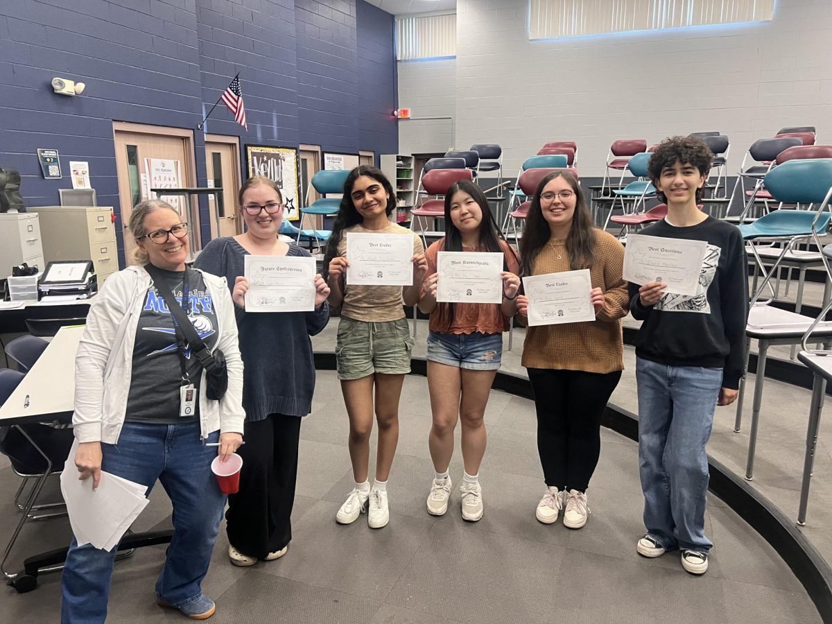Debate Night participants receive performance awards based on their discussion.